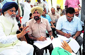 Bathinda Deputy Commissioner Dr Basant Garg (extreme right) during a sangat darshan programme of Chief Minister Parkash Singh Badal in Talwandi Sabo.