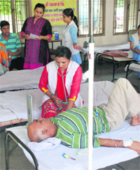 A health official attends to a patient suffering from diarrhoea at a dispensary in Sector 19, Panchkula, on Monday.