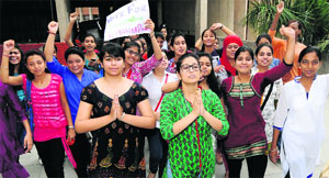Candidates seek votes with folded hands at the PGGCG-42 in Chandigarh on Monday.