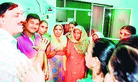 Slum dwellers of the Kot Ram Dass locality protest at the residence of Jalandhar (Central) MLA Manoranjan Kalia on Monday.