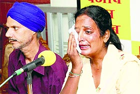 Manjit Kaur, a private ambulance driver, addresses the media in Jalandhar on Monday.