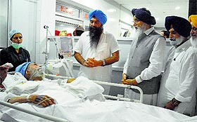 CM Parkash Singh Badal enquires after veteran Akali leader Jagdev Singh Talwandi at the DMCH in Ludhiana.