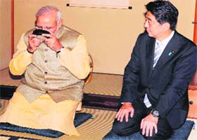 Prime Minister Narendra Modi with his Japanese counterpart Shinzo Abe during a tea ceremony in Tokyo on Monday