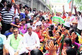 BJP leaders hold a protest demonstration against irregularities in distribution of rations cards at DM office in Dehradun on Monday