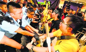 Pro-democracy protesters clash with police officers outside the Hong Kong government complex on Monday