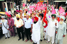 Activists of the Left parties hold a march in Bathinda on Tuesday.