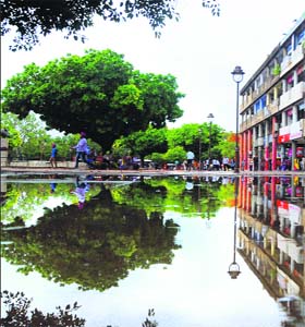 Mirror image: A waterlogged street at the Sector 17 Plaza after showers on Tuesday