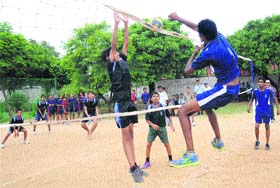 Players in action during a match of the inter-school volleyball championship at Government Model Senior Secondary School, Sector 26, in Chandigarh on Tuesday