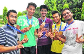 Members of the PU Campus table tennis team in a jubilant mood after winning the inter-college tournament on the campus in Chandigarh on Tuesday