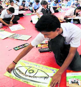 Students take part in an inter-school poster-making competition on eye donation at Manav Mangal Smart School, Phase X, in Mohali on Tuesday