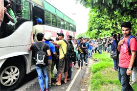 Students board a private bus from the PU campus for a party on Tuesday