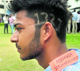 HEAD OVER HEELS: A supporter dons the code of an alliance panel in style at Post Graduate Government College, Sector 11, Chandigarh, on Tuesday