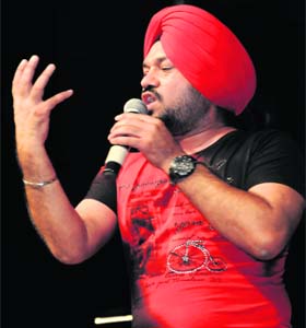 STAND-UP ACT: Gurpreet Ghuggi entertains the audience at Tagore Theatre on Tuesday