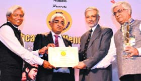 Dr Yogesh Chawla (right), Director of the PGI, receives the FICCI Healthcare Excellence Award in New Delhi