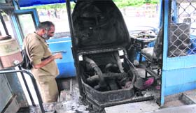 A conductor examines the extent of the damage at the ISBT, Sector 17, Chandigarh, on Tuesday