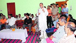 Excise and Taxation Minister Prakash Chaudhary addresses a meeting at Rewalsar in Mandi on Tuesday