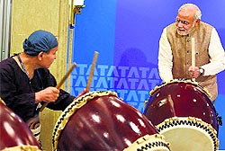 PM Narendra Modi beats a traditional Taiko drum in Tokyo on Tuesday