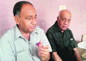 Subhash Sharma along with his father Mangat Ram Sharma talks to mediapersons in Kathua on Tuesday
