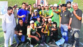 All smiles: Players of Mantaqi-11 pose for a photograph after defeating Pulwama-11 by 34 runs during a 20-20 cricket tournament at Awantipora in Pulwama on Tuesday
