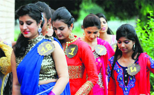 Participants of a modelling contest head towards the stage during a freshers’ party at the SCD Government College in Ludhiana