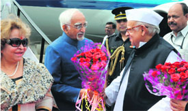 Governor Aziz Qureshi welcomes Vice President Hamid Ansari and his wife at the Jollygrant airport in Dehradun on Tuesday.