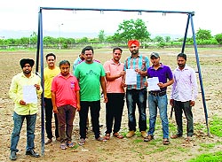 Residents show copies of their complaint against the installation of swings at the Sports Stadium at Bhabhat village in Zirkapur