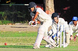 Players in action during a cricket match at Phase VIII in Mohali on Wednesday