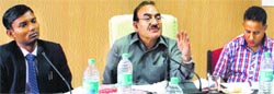 Health and Revenue Minister Kaul Singh Thakur addresses a meeting on disaster management in Mandi on Wednesday. Photo: Jai Kumar