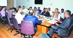 Chief Secretary P Mitra presides over a meeting in Shimla on Wednesday. Tribune photo
