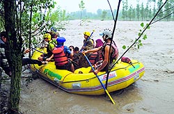 Army and police personnel evacuate people trapped in flood waters in south Kashmirs Kulgam district on Wednesday
