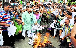 Activists of the BJP protest against the state government demanding regular supply of water and regularisation of services of daily wage workers of the PHE Department in Jammu on Wednesday