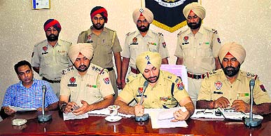 police officials at a press conference. 