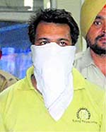 A snatcher in police custody.