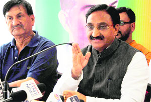 BJP parliamentarian Ramesh Pokhriyal Nishank addresses a press conference at the party office in Dehradun on Wednesday.