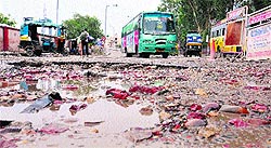 The entry point to bus stand lies in an extremely tattered condition, especially after early morning showers in Jalandhar on Wednesday