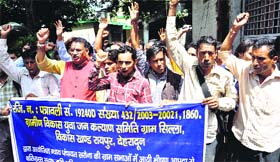 Villagers protest at the District Magistrates office against damaged roads in the Raipur block in Dehradun on Thursday.