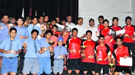 Winners of the All India IPSC Table Tennis Tournament celebrate during the closing ceremony at Welham Boys School in Dehradun on Thursday.