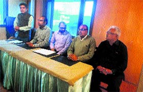 Members of the Traders Association address mediapersons on the issue of water shortage in Mussoorie on Thursday.