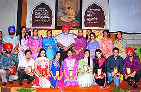 Teachers with mementoes presented at a function at Khalsa College of Education in Amritsar on Friday