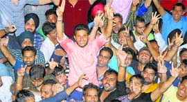 NSUI presidential candidate Divyanshu Budhiraja celebrates his victory with supporters at the Student Centre on Friday.