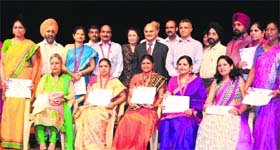 UT Adviser KK Sharma with teachers honoured during a special function at Tagore Theatre in Chandigarh on Friday.