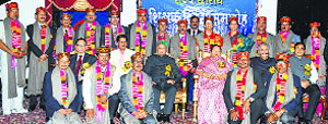 The recipients of the National and State Awards with Governor Urmila Singh and Chief Minister Virbhadra Singh at the state-level Teachers Day function at Raj Bhawan in Shimla on Friday.