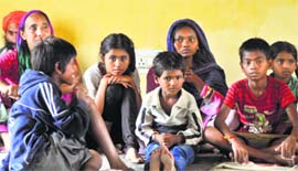 Evacuated residents at Yatri Nivas in Bhagwati Nagar, Jammu, on Friday.