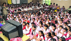 Students watch Prime Minister Narendra Modis speech at Govt Girls School on the Ladowali road in Jalandhar on Friday. Photo: Sarabjit Singh 