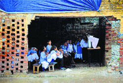 Students watch PM Modis speech on TV in a makeshift room at Government Primary School, Field Gunj, Ludhiana. Tribune Photo: Himanshu Mahajan