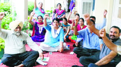 Members of the Punjab and Chandigarh Teachers' Union hold a protest at LRDAV College in Jagraon on Friday. A Tribune photograph