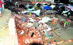 A woman was killed when a wall collapsed on dwellings in Raisinghnagar, Sriganganagar