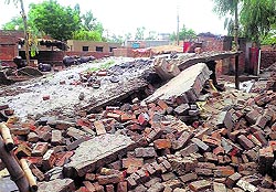 The debris of a collapsed house at Ghubaya village in Ferozepur district