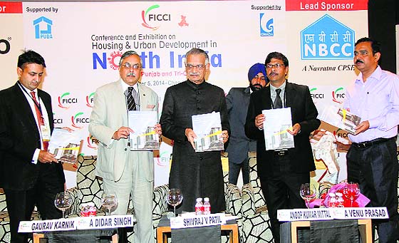 Punjab Governor Shivraj Patil releases FICCI-EY North India Real Estate report 2014 in Chandigarh.