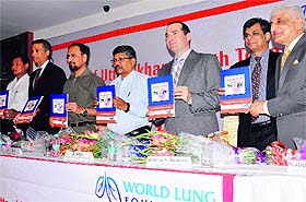 Dignitaries launch a tobacco survey book during a programme organised by World Lung Foundation in Dehradun on Friday.